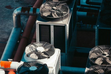 a-group-of-air-conditioners-sitting-next-to-each-other.jpg a group of air conditioners sitting next to each other